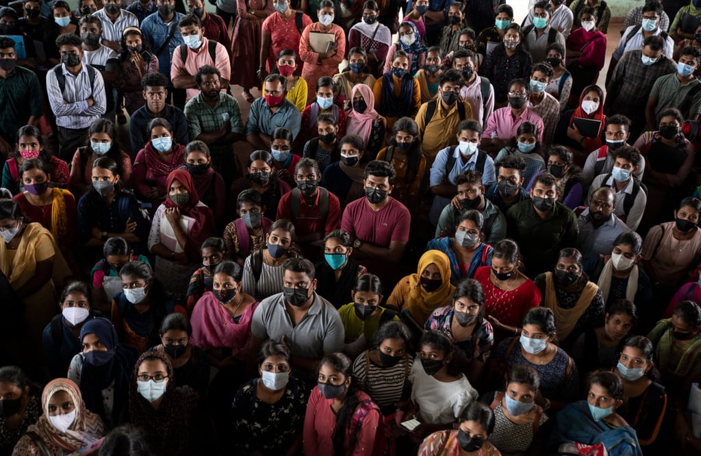 Job candidates wait outside a packed venue after larger than anticipated numbers turned up for interviews organised by the state-run employment centre in Kochi in the Indian state of Kerala on July 8. Photo: AP