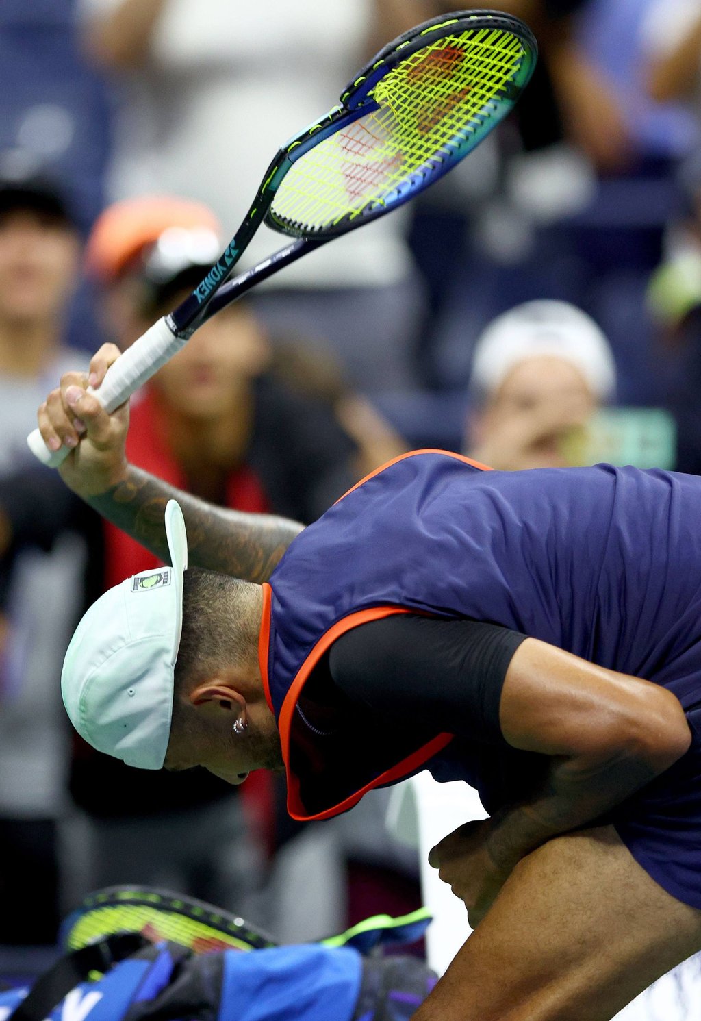 A frustrated Nick Kyrgios smashes his racket after being defeated by Karen Khachanov. Photo: AFP