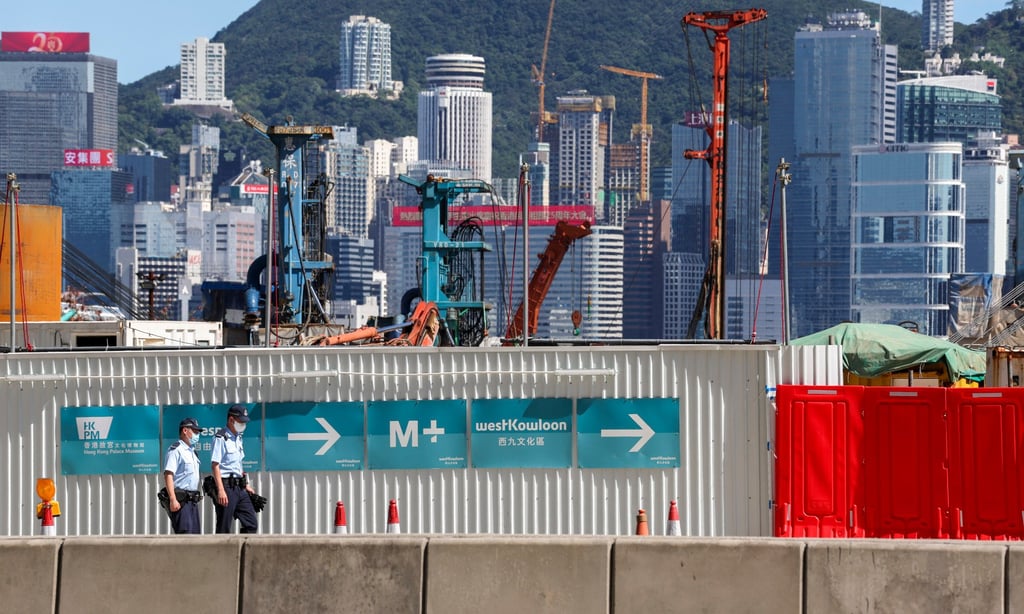 Police officers patrol outside a construction site in the West Kowloon Cultural District on June 28, 2022. Photo: SCMP / Yik Yeung-man