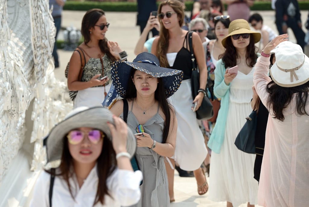 Tourists from China and elsewhere visit a temple in Chiang Rai, northern Thailand, before the Covid-19 pandemic. Photo: AFP Tourists from China and elsewhere visit a temple in Chiang Rai, northern Thailand, before the Covid-19 pandemic. Photo: AFP