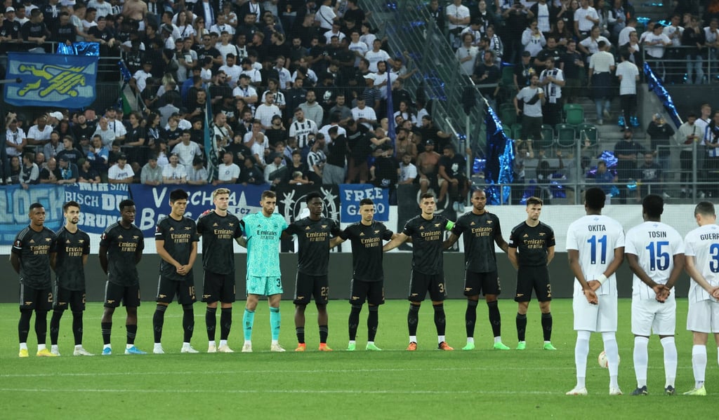 Arsenal players during a minute’s silence before the start of the second half of their match against FC Zurich after the death of Queen Elizabeth. Photo: Reuters