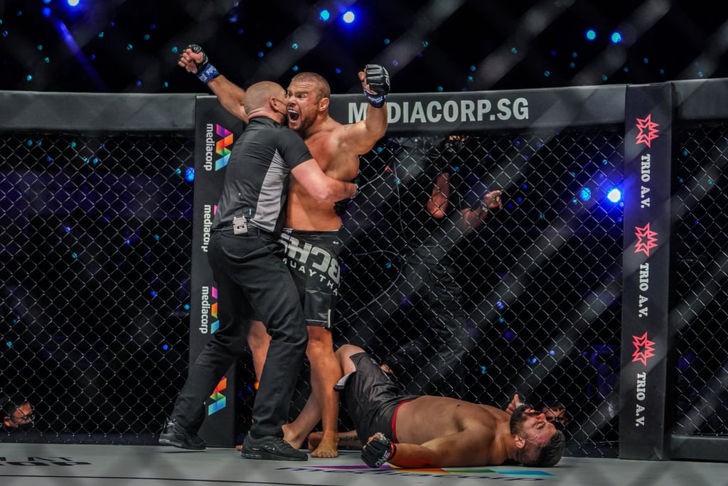 Anatoly Malykhin celebrates after knocking out Amir Aliakbari.