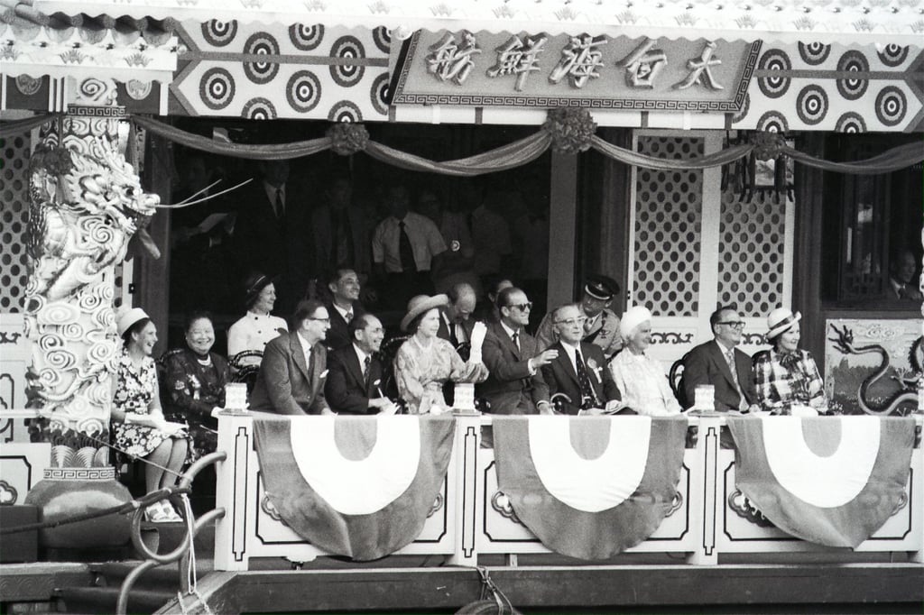 Queen Elizabeth and Prince Philip (sixth and fifth from right) watch a water pageant in Aberdeen from the Tai Pak Seafood Floating Restaurant during their May 1975 visit to the city. Photo: P.Y. Tang