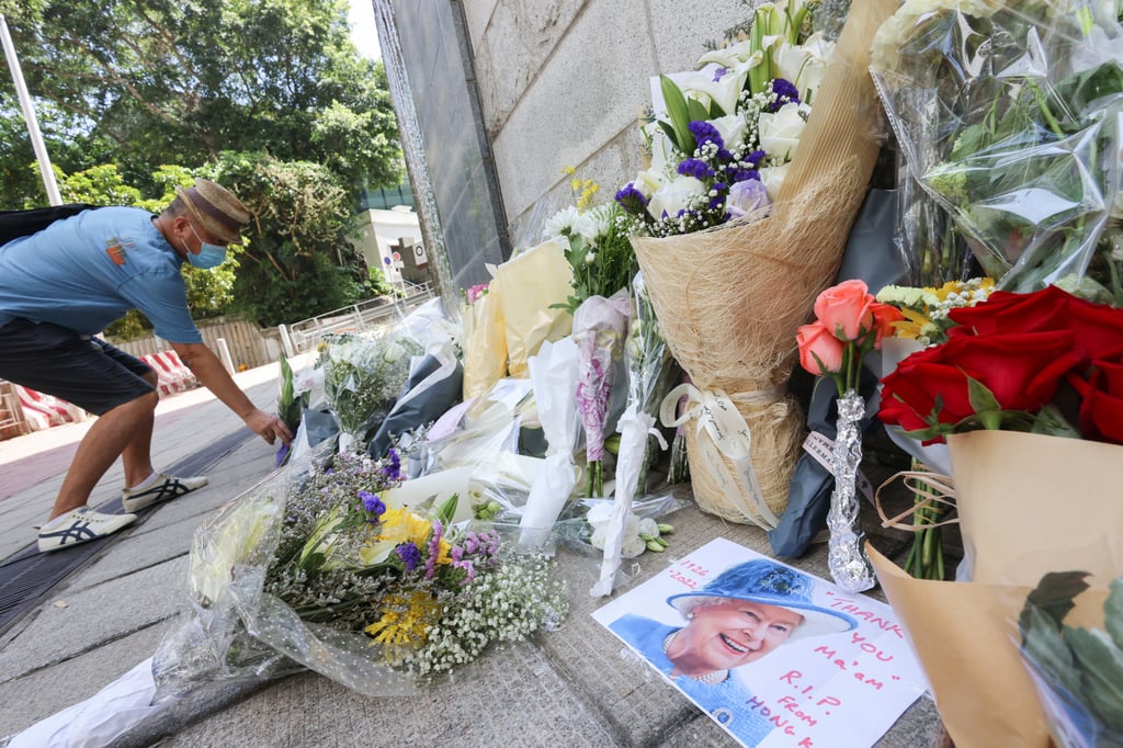People leave flowers outside the British consulate in Hong Kong to mark Queen Elizabeth’s death. Photo: Dickson Lee