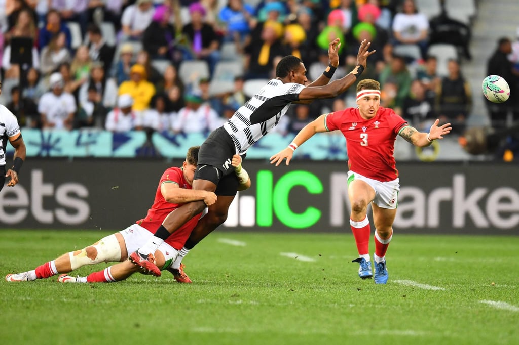 Wales and Fiji vie for the ball. Photo: AFP Wales and Fiji vie for the ball. Photo: AFP