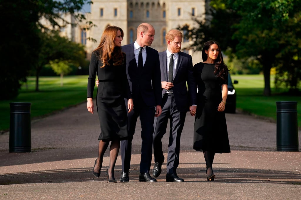 From left, Kate, the Princess of Wales, Prince William, Prince of Wales, Prince Harry and Meghan, Duchess of Sussex walk to meet members of the public at Windsor Castle, following the death of Queen Elizabeth on Saturday. Photo: Pool via AP