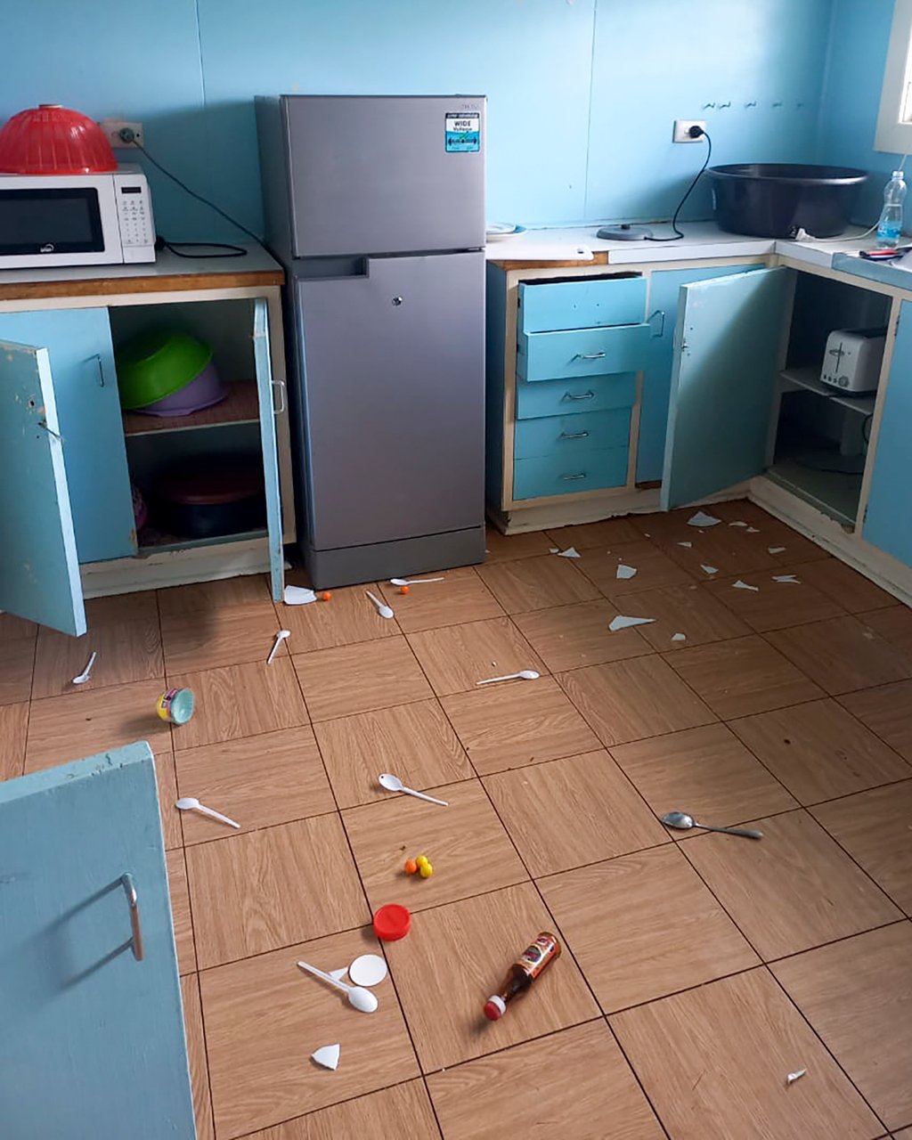 Debris lies strewn across the floor in the kitchen of Renagi Ravu’s house in Kainantu, following a 7.6 magnitude earthquake in northeastern Papua New Guinea on Sunday. Photo: Renagi Ravu via AP