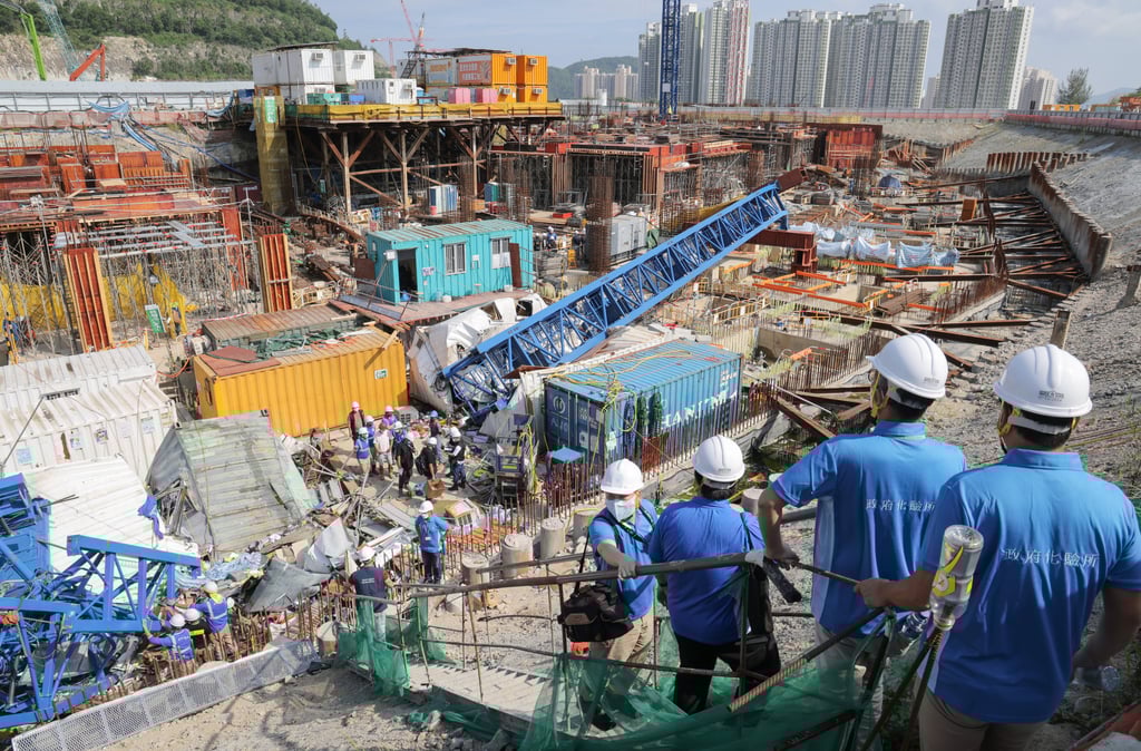 Construction workers at the site of the accident that killed three and injured six. Photo: Jelly Tse Construction workers at the site of the accident that killed three and injured six. Photo: Jelly Tse