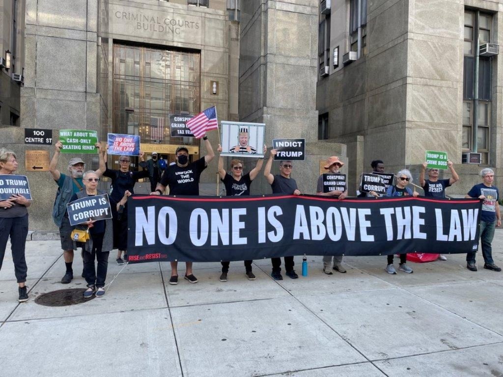 A group of protesters gather outside New York state court in Manhattan where a pre-trial hearing is scheduled in a tax fraud case against Donald Trump’s namesake company, the Trump Organization on Monday. Photo: Reuters A group of protesters gather outside New York state court in Manhattan where a pre-trial hearing is scheduled in a tax fraud case against Donald Trump’s namesake company, the Trump Organization on Monday. Photo: Reuters