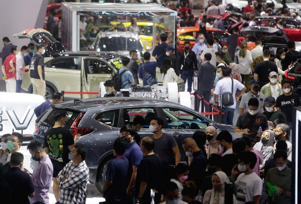 Visitors throng an auto show in Indonesia last month. New US regulations pave the way for Indonesia to expand its burgeoning EV battery industry beyond the Chinese market. Photo: EPA-EFE