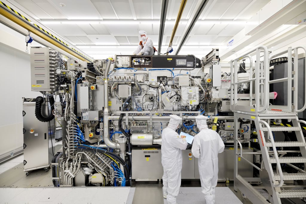 Employees are seen working on the final assembly of ASML’s Twinscan NXE:3400B advanced semiconductor lithography machine, with its panels removed, in Veldhoven, the Netherlands, on April 4, 2019. Photo: Reuters Employees are seen working on the final assembly of ASML’s Twinscan NXE:3400B advanced semiconductor lithography machine, with its panels removed, in Veldhoven, the Netherlands, on April 4, 2019. Photo: Reuters