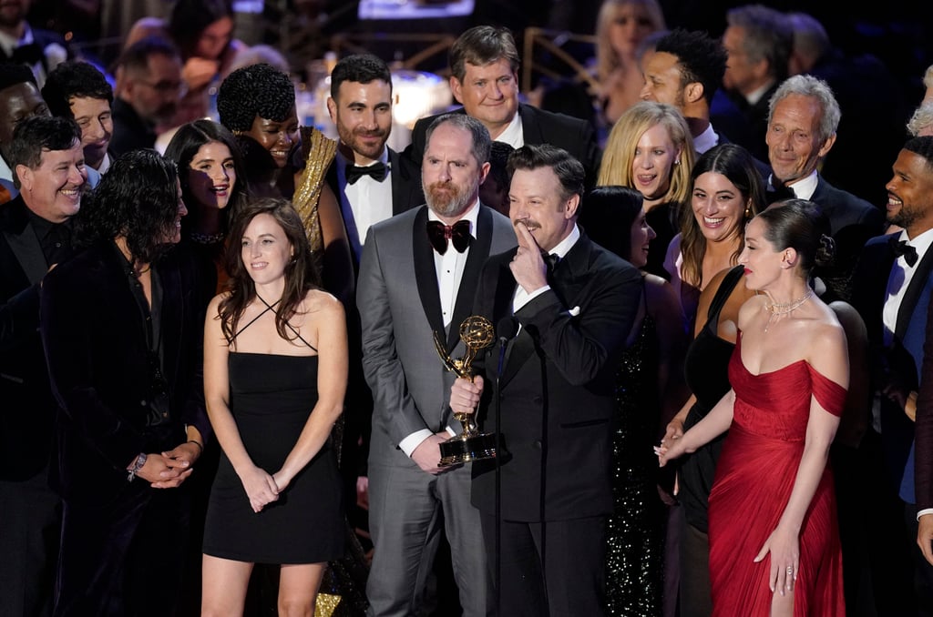 Jason Sudeikis, centre, and the cast of Ted Lasso accept the Emmy for outstanding comedy series. Photo: AP