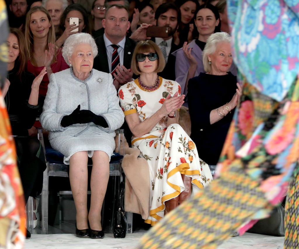 Britain’s Queen Elizabeth sits next to Vogue editor-in-chief Anna Wintour, Caroline Rush, chief executive of the British Fashion Council, and royal dressmaker Angela Kelly as they view Richard Quinn’s runway show before presenting him with the inaugural Queen Elizabeth Award for British Design as she visits London Fashion Week, in February 2018. Photo: Reuters