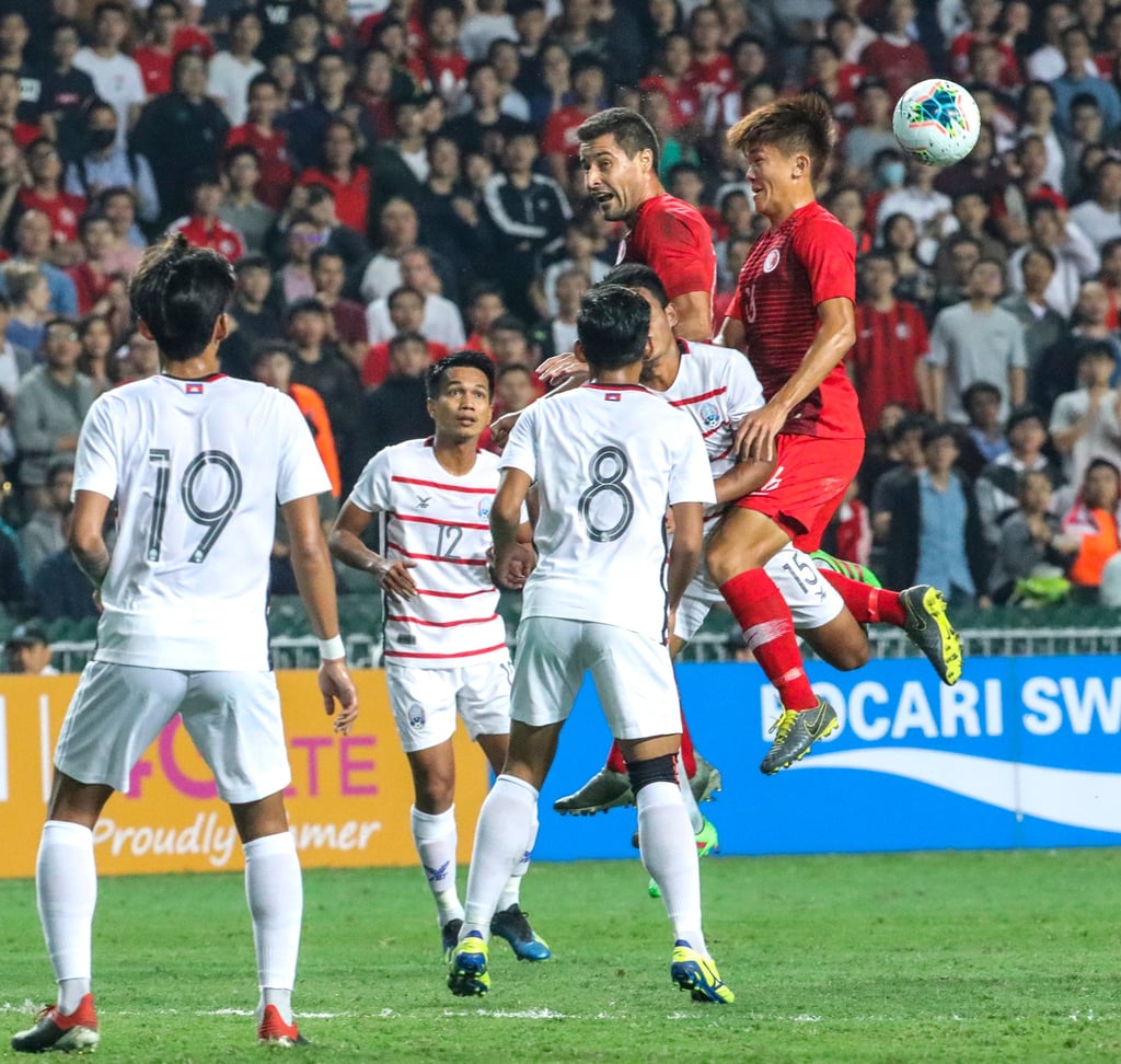 Tan Chun-lok (right) heads the ball against Cambodia in Hong Kong’s last home match, in 2019. Photo: May Tse