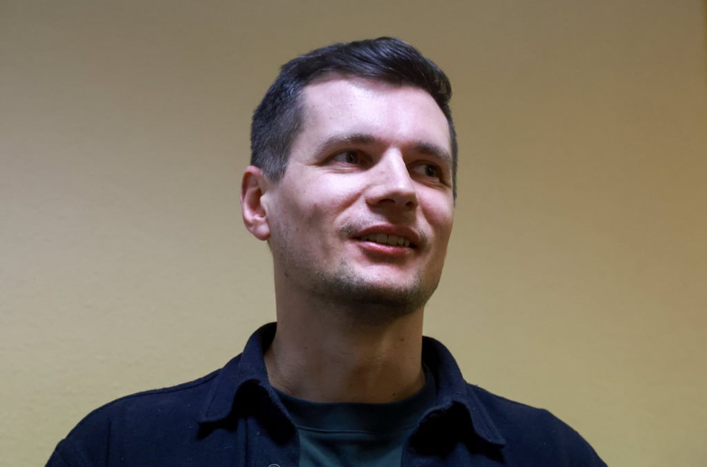 Smolninskoye municipality council member Dmitry Palyuga, who was fined for public activity aimed at discrediting the Russian authorities, reacts inside a court building after a hearing in St Petersburg on Tuesday. Photo: Reuters