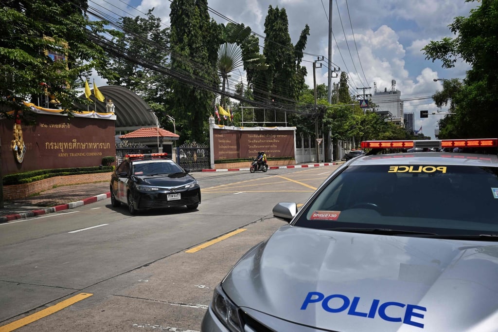 Police cars are seen parked outside the gates of the college’s Army Training Command compound on Wednesday. Photo: AFP Police cars are seen parked outside the gates of the college’s Army Training Command compound on Wednesday. Photo: AFP