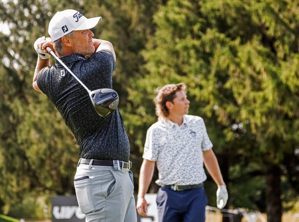 Cameron Smith (right) watches as Matt Jones hits a tee shot on the 18th during practice for the LIV Golf Invitational in Sugar Grove. Photo: EPA-EFE Cameron Smith (right) watches as Matt Jones hits a tee shot on the 18th during practice for the LIV Golf Invitational in Sugar Grove. Photo: EPA-EFE