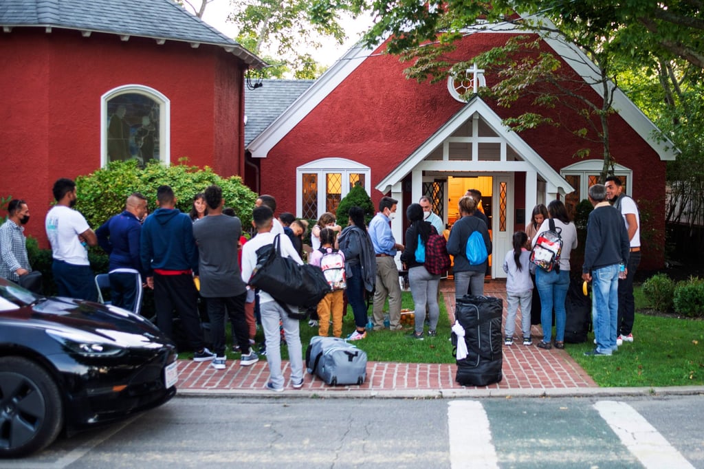 Immigrants gather with their belongings in Edgartown on Martha’s Vineyard after being sent there by Florida Governor Ron DeSantis. Photo: AP