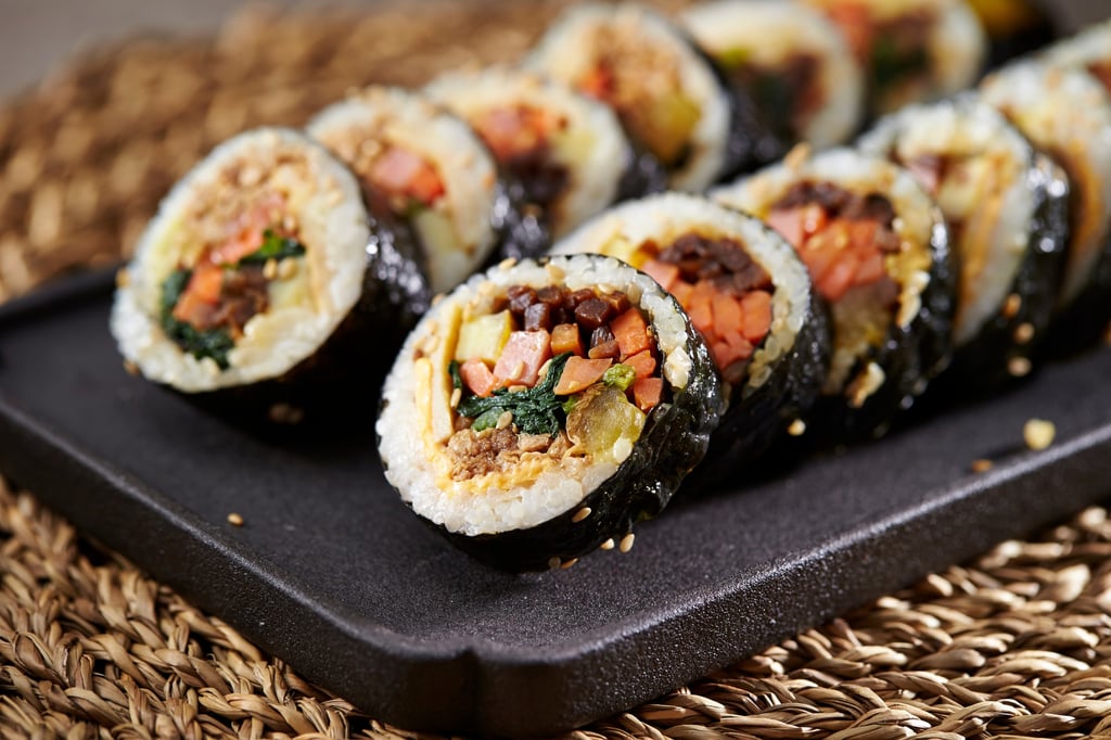 Kimbap is traditionally made from rice, cooked vegetables and other fillings rolled in a dried sheet of seaweed. Photo: Shutterstock Kimbap is traditionally made from rice, cooked vegetables and other fillings rolled in a dried sheet of seaweed. Photo: Shutterstock