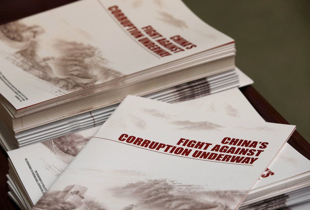 Copies of a booklet published by the Central Commission for Discipline Inspection anti-corruption watchdog at a 2016 news conference in Beijing. Photo: Reuters