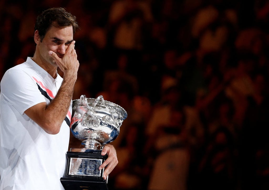 Roger Federer cries while holding the 2018 Australia Open trophy. Photo: Reuters Roger Federer cries while holding the 2018 Australia Open trophy. Photo: Reuters