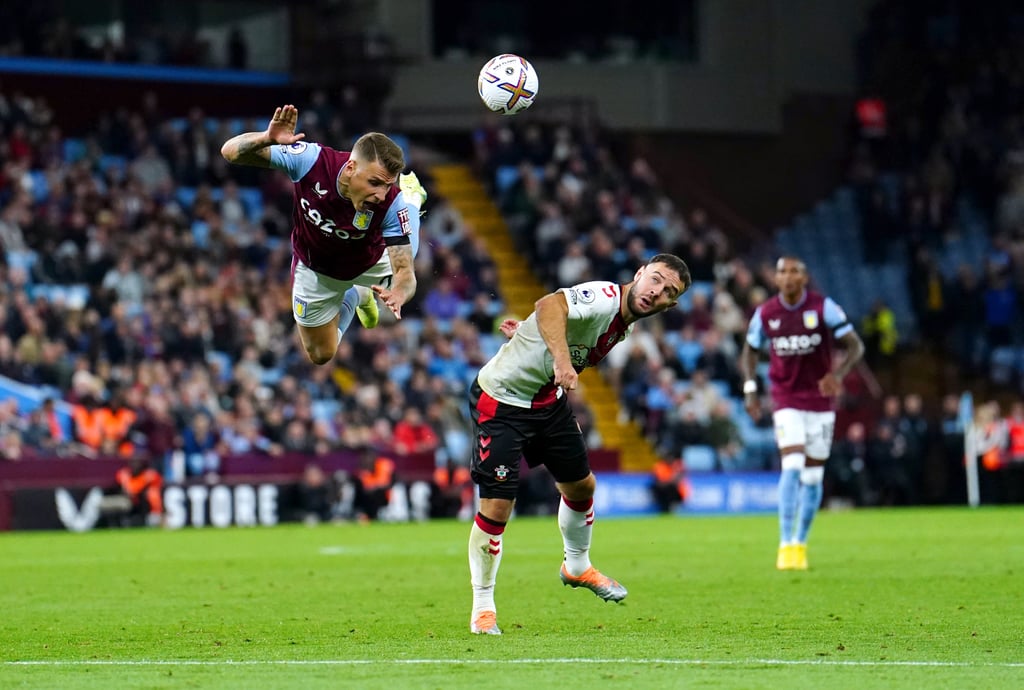 16 September 2022, United Kingdom, Birmingham: Aston Villa’s Lucas Digne (L) and Southampton’s Adam Armstrong battle for the ball during the English Premier League soccer match between Aston Villa and Southampton at Villa Park. Photo: Martin Rickett/PA Wire/dpa
