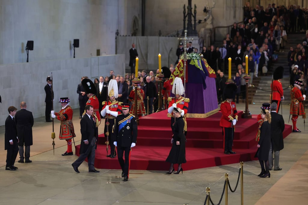 Queen Elizabeth’s grandchildren James, Viscount Severn, Peter Phillips, the Prince of Wales, Zara Tindall and Lady Louise Windsor depart after holding a vigil beside the coffin of their grandmother as it lies in state on the catafalque in Westminster Hall, at the Palace of Westminster. Photo: dpa
