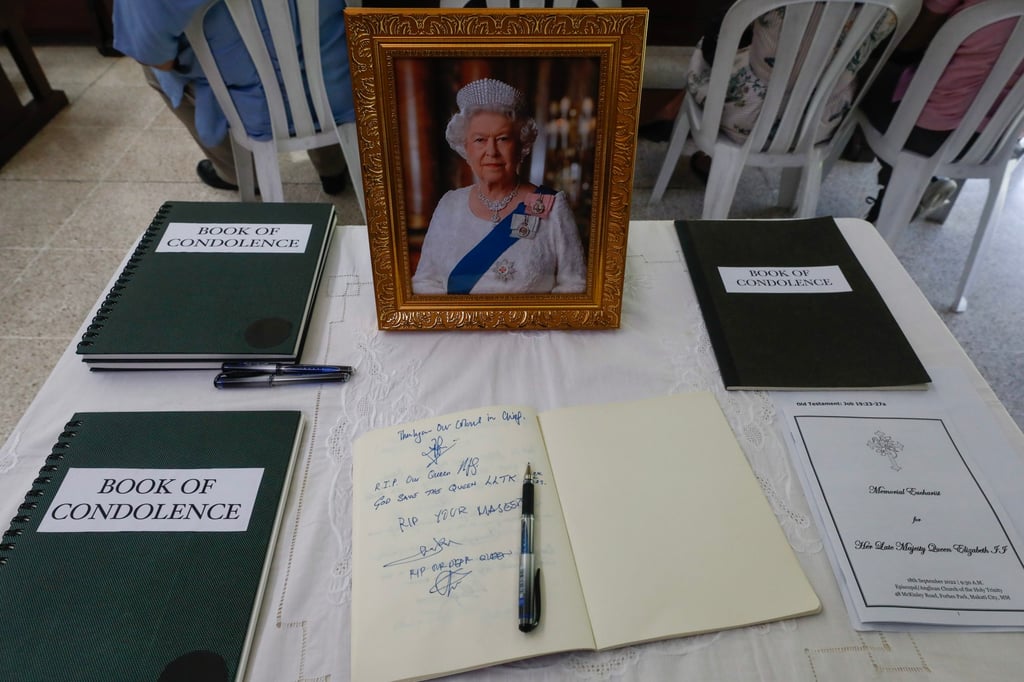 Condolence books are prepared at a table for people attending a memorial service for Britain’s late Queen Elizabeth in the Philippines. Photo: EPA-EFE Condolence books are prepared at a table for people attending a memorial service for Britain’s late Queen Elizabeth in the Philippines. Photo: EPA-EFE