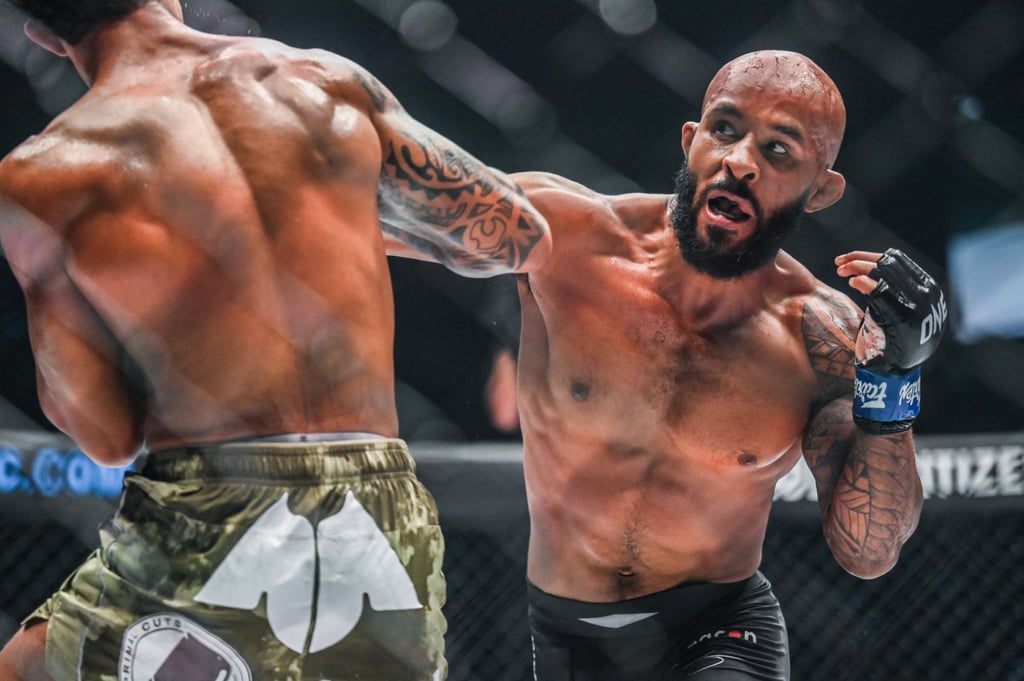 Demetrious Johnson throws a punch at Adriano Moraes at ONE on Prime Video 1.