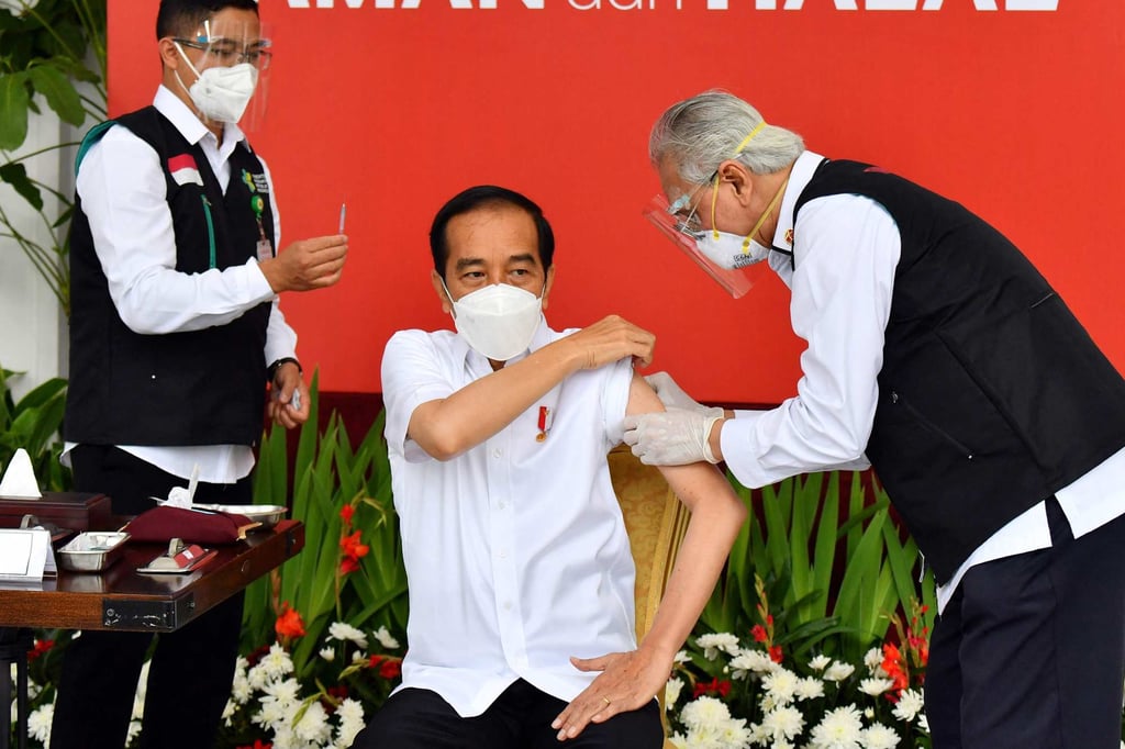 Indonesian President Joko Widodo, also known as Jokowi, receives a dose of Covid-19 vaccine in January last year. Photo: Indonesia’s Presidential Palace Handout via AFP