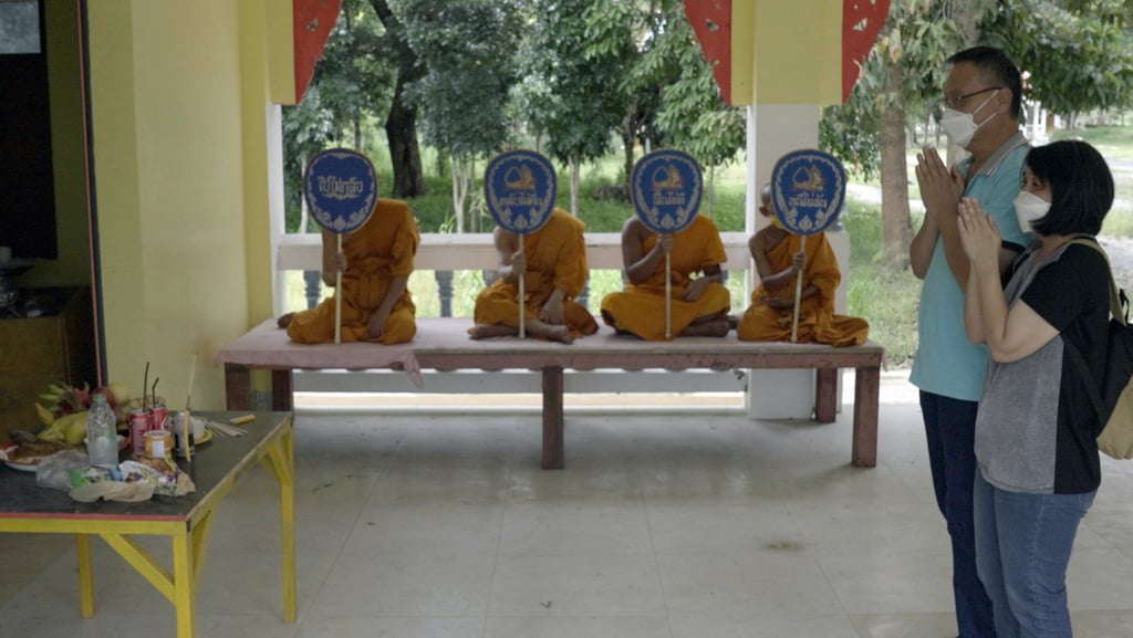 Malaysian Goi Zhen Feng’s parents at a Buddhist cremation ceremony for their 23-year-old son in Thailand last week. Photo: Aidan Jones Malaysian Goi Zhen Feng’s parents at a Buddhist cremation ceremony for their 23-year-old son in Thailand last week. Photo: Aidan Jones