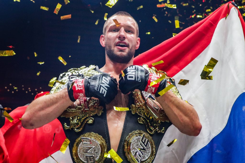 Reinier de Ridder celebrates after beating Kiamrian Abbasov to defend the ONE Championship middleweight title.