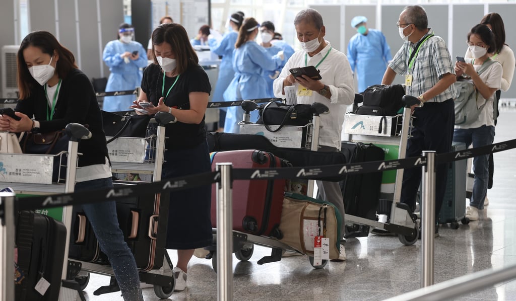Arriving travellers seen at the Hong Kong airport as the government announces changes to its quarantine policy from September 26. Photo: K.Y. Cheng Arriving travellers seen at the Hong Kong airport as the government announces changes to its quarantine policy from September 26. Photo: K.Y. Cheng