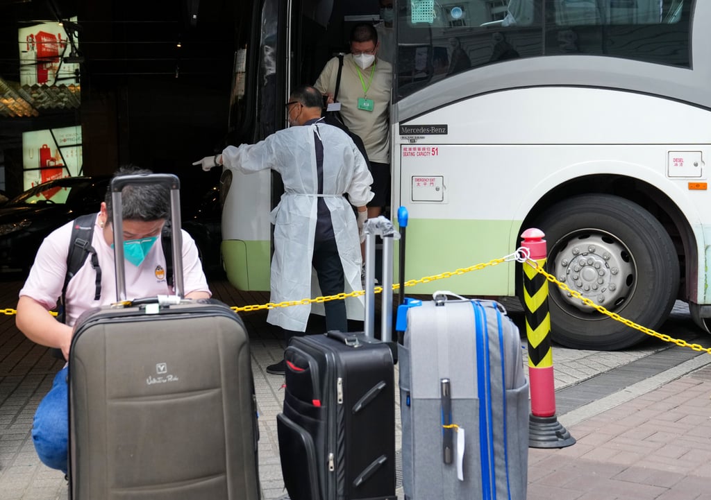 Travellers arrive at a designated quarantine hotel in Tsim Sha Tsui. Photo: Sam Tsang Travellers arrive at a designated quarantine hotel in Tsim Sha Tsui. Photo: Sam Tsang