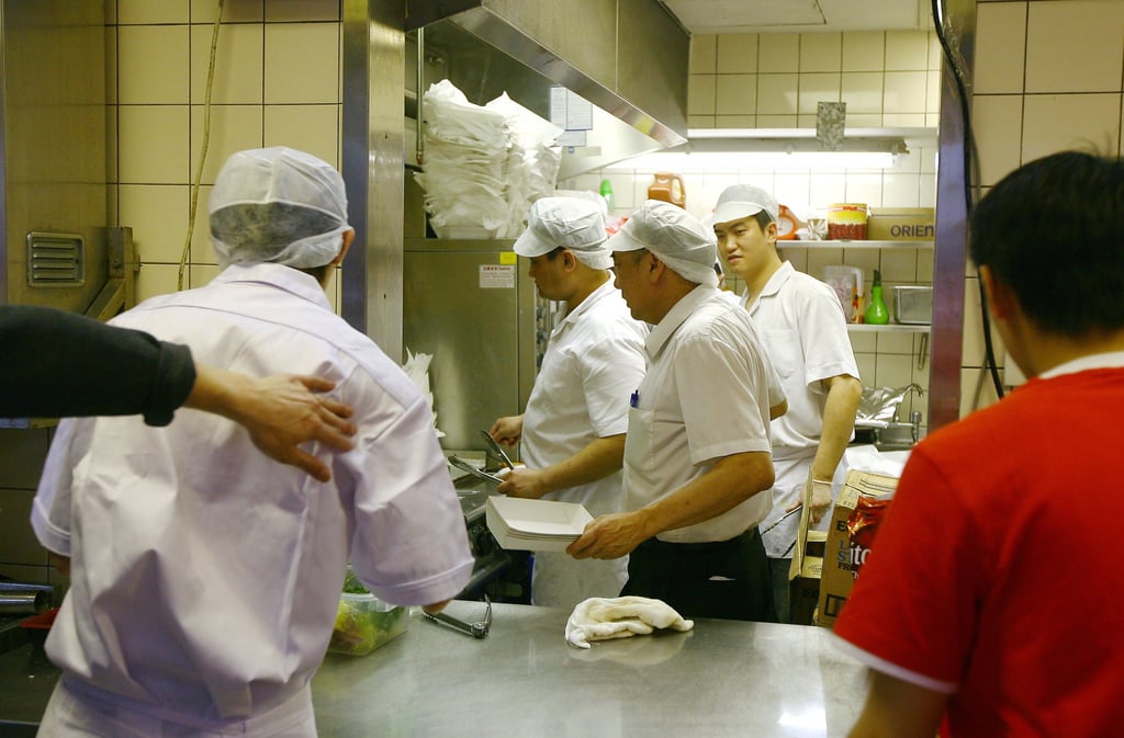 Staff prepare food at one of the catering providers at the Hong Kong Sevens. Photo: K.Y. Cheng Staff prepare food at one of the catering providers at the Hong Kong Sevens. Photo: K.Y. Cheng