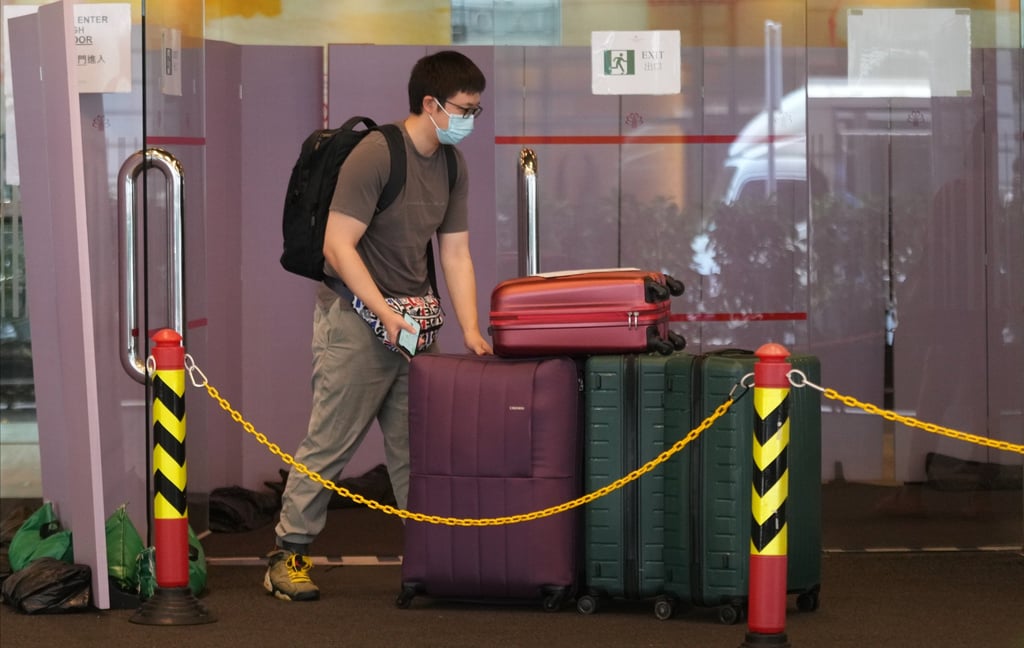 A traveller leaves Kowloon Hotel, a designated quarantine spot in Tsim Sha Tsui. Photo: Sam Tsang A traveller leaves Kowloon Hotel, a designated quarantine spot in Tsim Sha Tsui. Photo: Sam Tsang