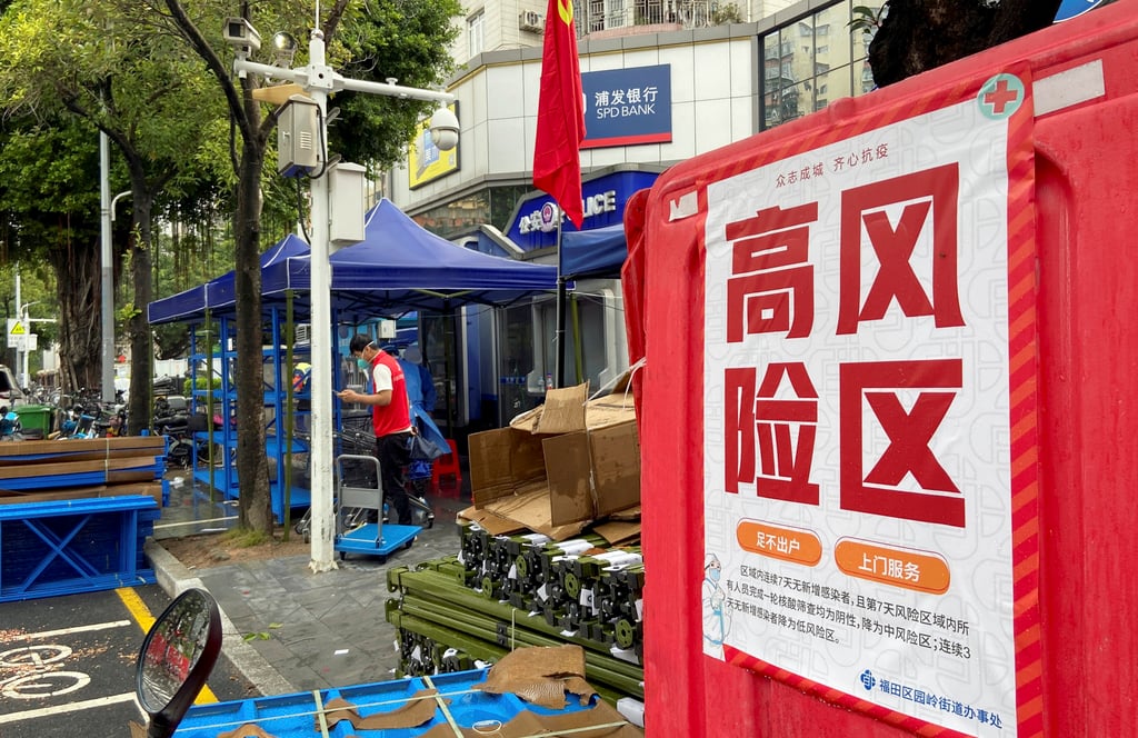 A sign outside a compound in Futian district in Shenzhen warns of a Covid-19 high risk area. Photo: Reuters A sign outside a compound in Futian district in Shenzhen warns of a Covid-19 high risk area. Photo: Reuters