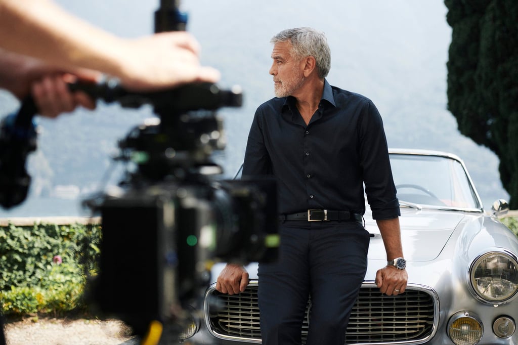 An exclusive behind-the-scenes shot of Hollywood actor George Clooney wearing the Omega Speedmaster ’57. An exclusive behind-the-scenes shot of Hollywood actor George Clooney wearing the Omega Speedmaster ’57.