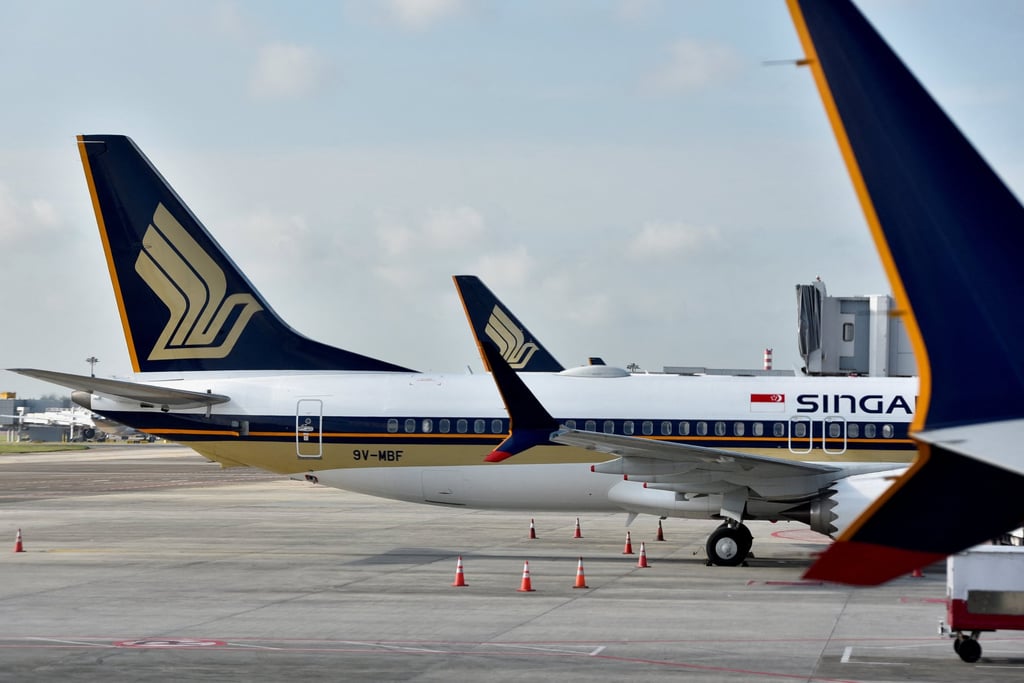Singapore Airlines planes are seen on the tarmac at Changi Airport in Singapore. Photo: Reuters Singapore Airlines planes are seen on the tarmac at Changi Airport in Singapore. Photo: Reuters