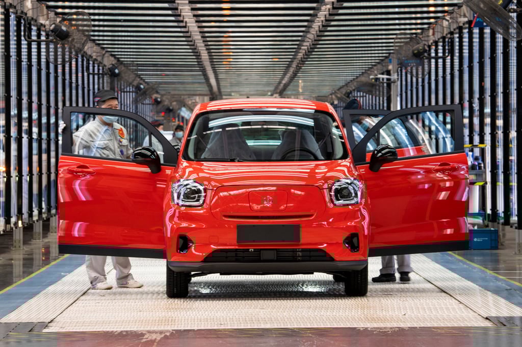 Engineers work on the assembly line of T03 electric small crossover at a factory of Zhejiang Leapmotor on April 26, 2022. Photo: Getty Images