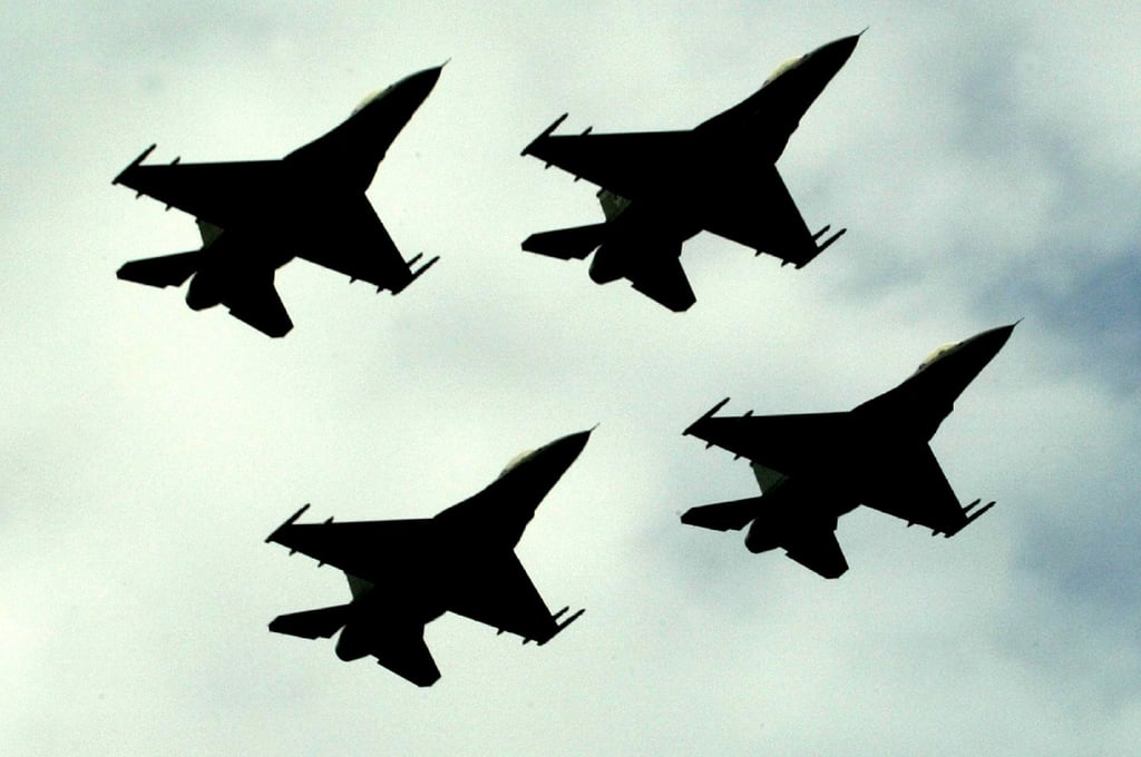Pakistan Air Force F-16 fighter jets fly in formation during a National Day ceremony in Islamabad. Photo: AP Pakistan Air Force F-16 fighter jets fly in formation during a National Day ceremony in Islamabad. Photo: AP