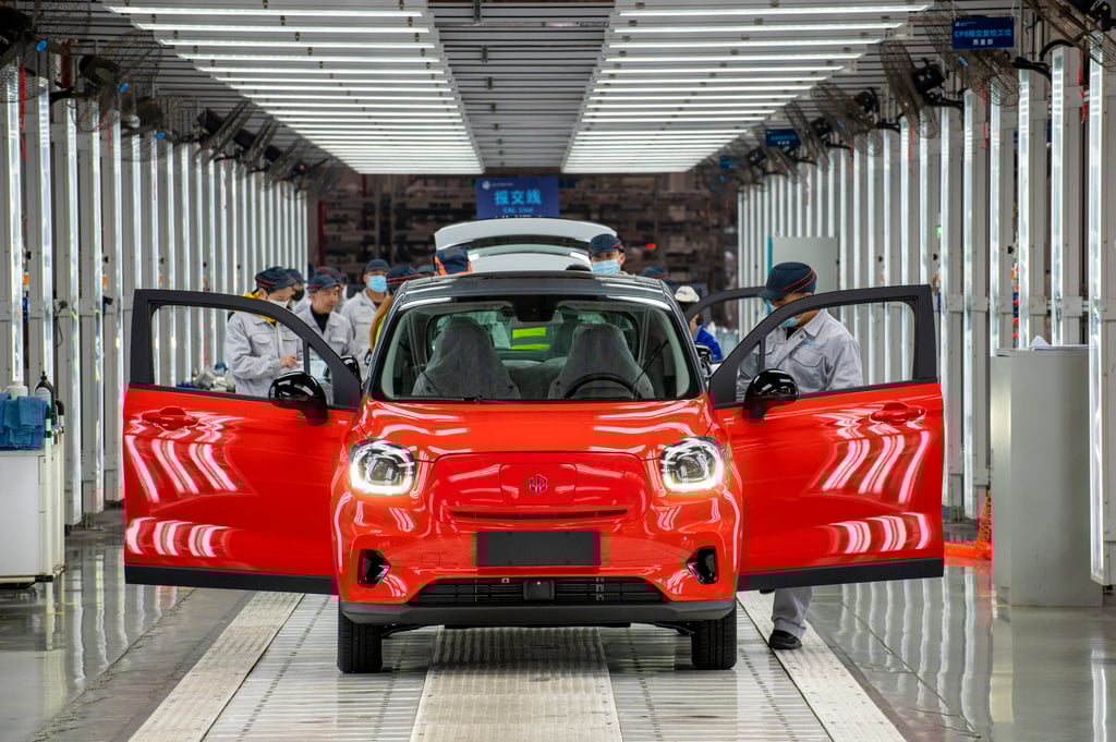 Employees work on the assembly line of T03 model at a factory of Chinese EV maker Leapmotor on December 17, 2021 in Jinhua, in China’s Zhejiang province. Photo: Getty Images