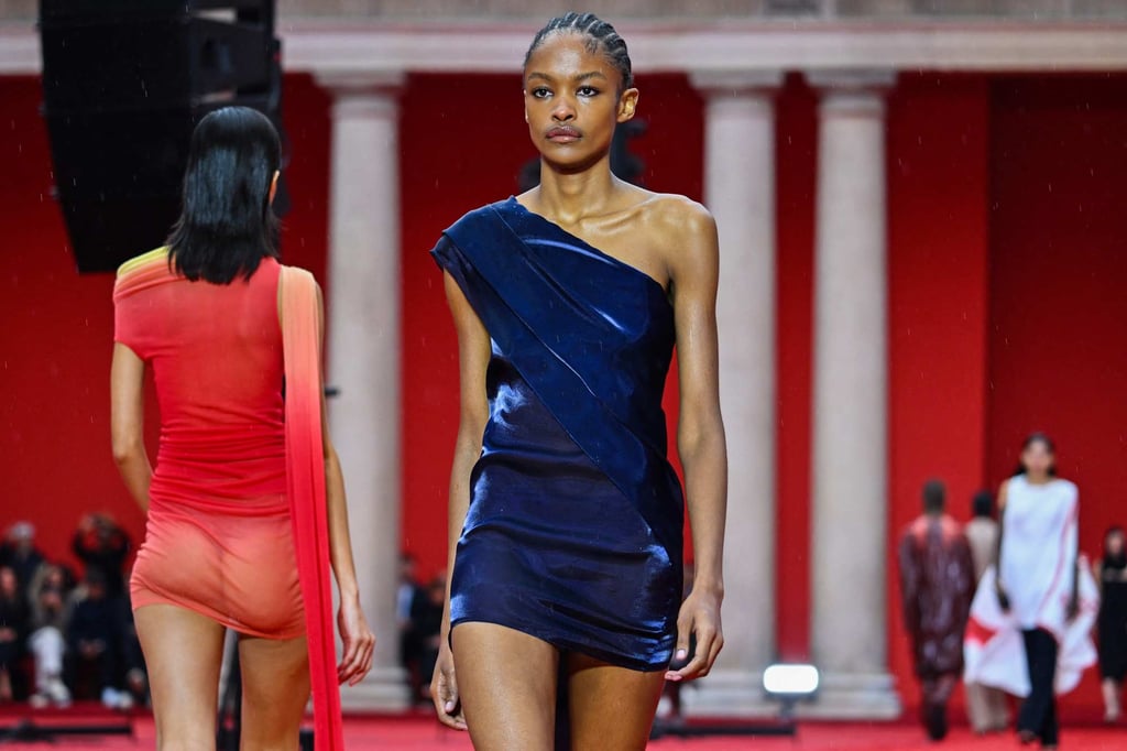 Milan Fashion Week 2022 Ferragamo s new dawn with Maximilian Davis showcased its bold colourful spring summer 2023 collection as models trod on red sand and Naomi Campbell was in the crowd