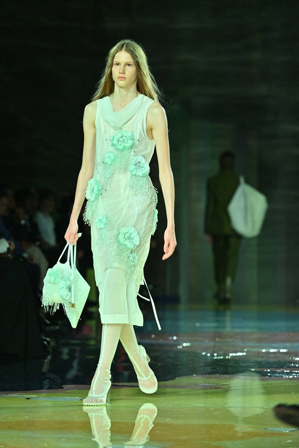 A model presents an embellished sheer dress for the Bottega Veneta’s women and men spring-summer 2023 fashion collection on September 24, as part of the fashion week in Milan. Photo: AFP A model presents an embellished sheer dress for the Bottega Veneta’s women and men spring-summer 2023 fashion collection on September 24, as part of the fashion week in Milan. Photo: AFP