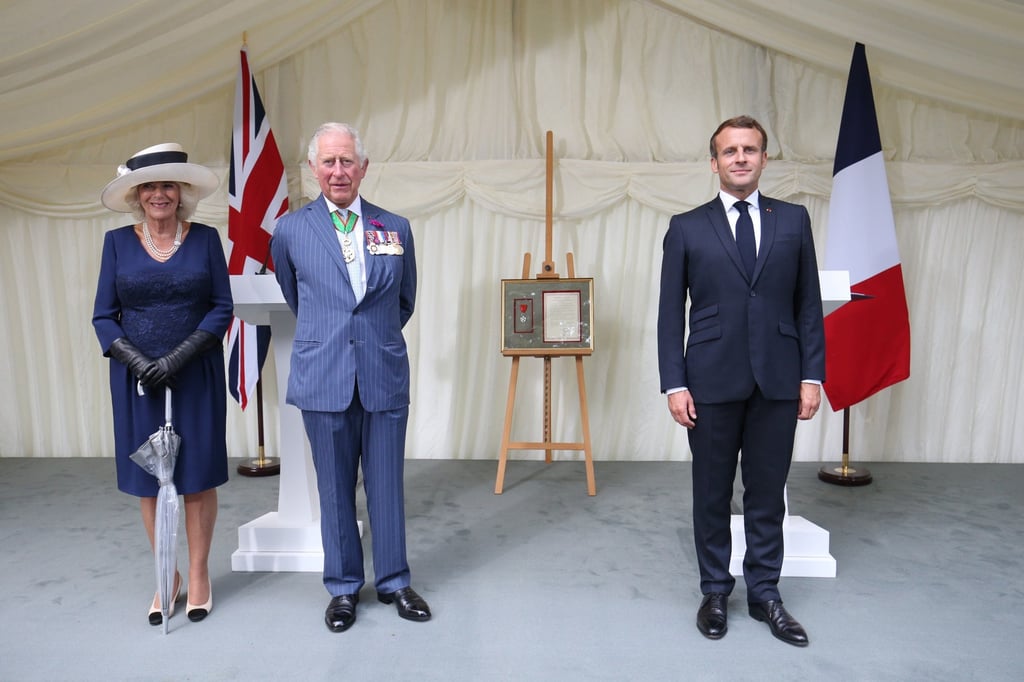 French president Emmanuel Macron, then Prince Charles, Prince of Wales and Camilla, then Duchess of Cornwall attend a ceremony in Carlton Gardens during a visit to commemorate the 80th anniversary of General de Gaulle’s speech in June 2020, in London, England. Photo: Getty Images