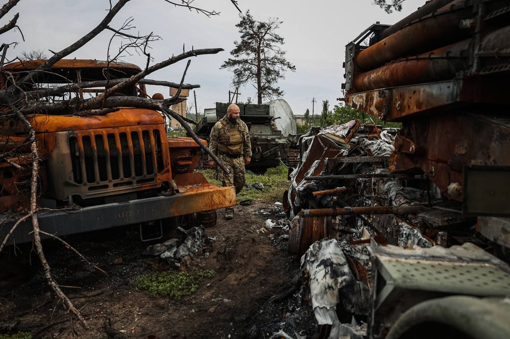 A Ukrainian serviceman examines a destroyed Russian Uragan MLRS near the village of Sosnove in Donetsk region on Friday amid the Russian invasion of Ukraine. Photo: AFP A Ukrainian serviceman examines a destroyed Russian Uragan MLRS near the village of Sosnove in Donetsk region on Friday amid the Russian invasion of Ukraine. Photo: AFP