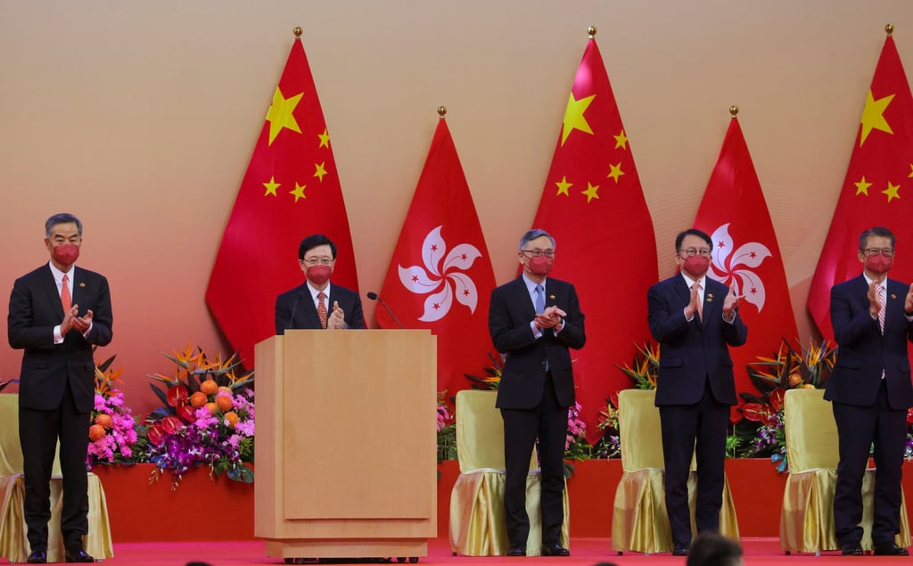 John Lee, flanked by officials and political figures at the Convention and Exhibition Centre. Photo: Jelly Tse John Lee, flanked by officials and political figures at the Convention and Exhibition Centre. Photo: Jelly Tse