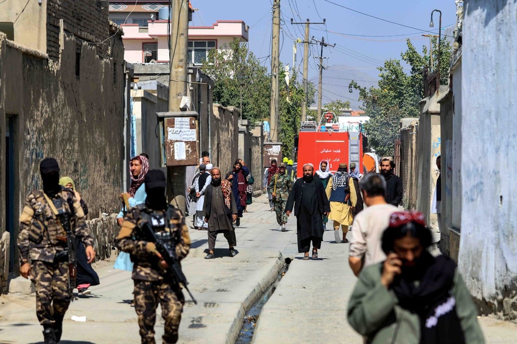 Taliban forces stand guard at the scene of a bomb blast in Kabul, Afghanistan on Friday. Photo: EPA-EFE Taliban forces stand guard at the scene of a bomb blast in Kabul, Afghanistan on Friday. Photo: EPA-EFE
