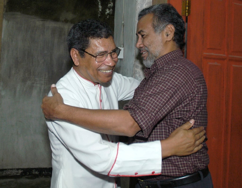 East Timor’s then President Xanana Gusmao, right, welcomes the country’s influential Roman Catholic Bishop Carlos Ximenes Belo in 2004. File photo: AP