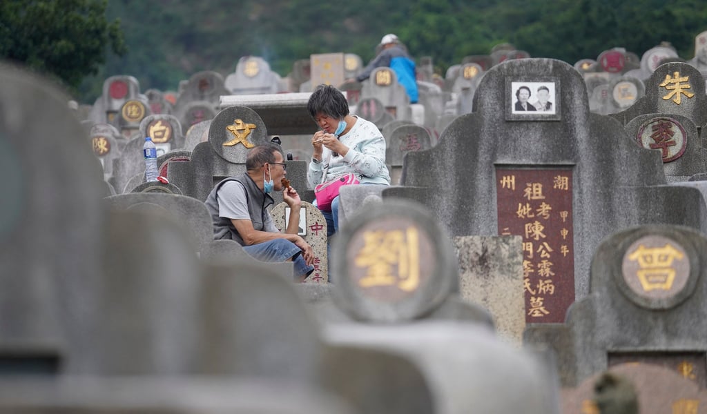 People sweep graves and offer food to their ancestors during Chung Yeung Festival. Photo: Winson Wong